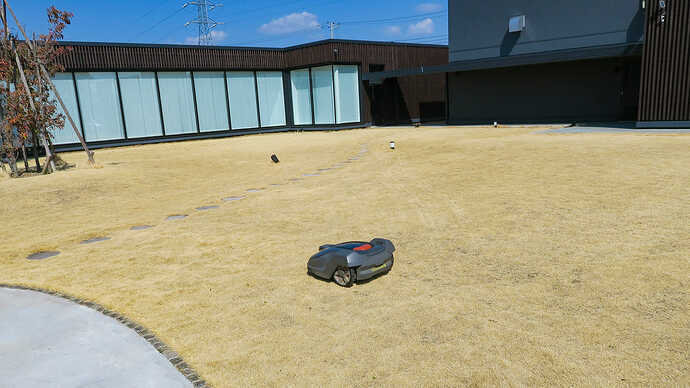 Automatic lawn mower was operating in the field