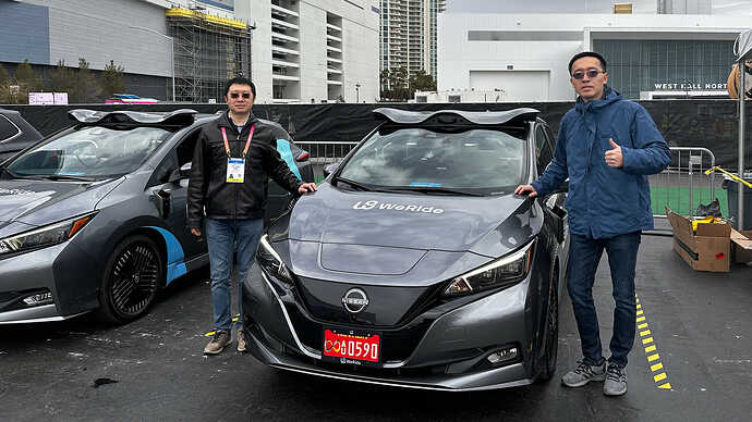 WeRide CEO Tony Han next to the demo vehicle with WeRide Sensor Suite 5.1.