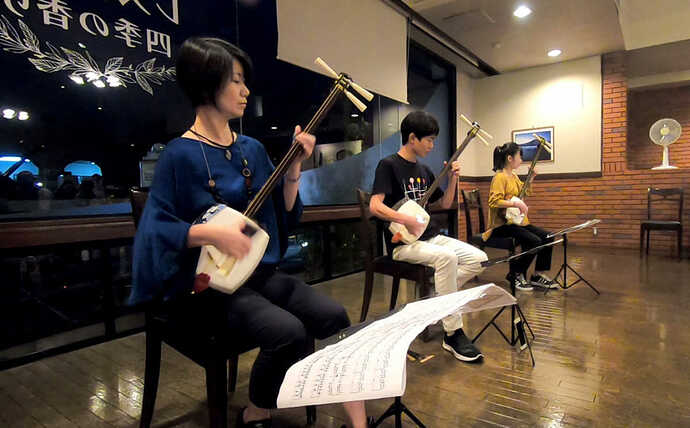The Katsumata family playing the shamisen.
