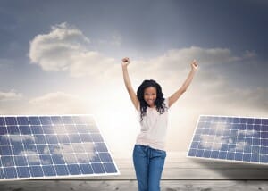 Composite image of a happy young woman is standing with her hands in the air