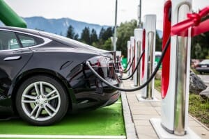 Electric car charging at electric petrol station - E-Mobility