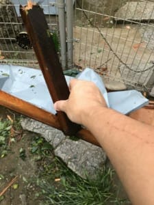 Wood debris with sharp, embedded nails had flown into the family property. 